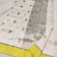 Ivory Chanderi saree with grey floral-bud motifs, lemon-yellow border and broad silver-toned woven pallu