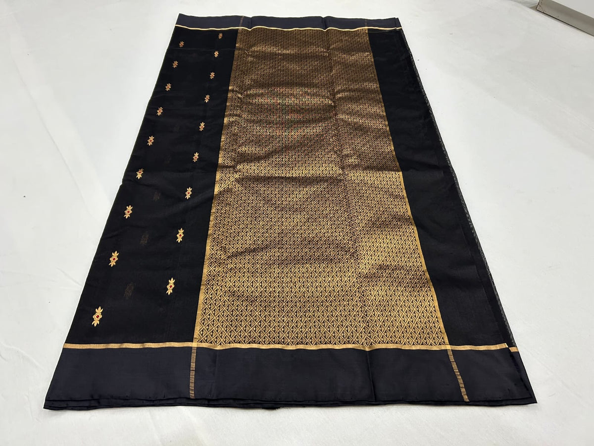 Close view of midnight black Chanderi saree with gold butis