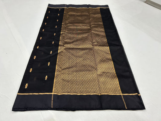 Close view of midnight black Chanderi saree with gold butis