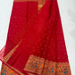 Vermilion red Chanderi saree with antique-gold floral border