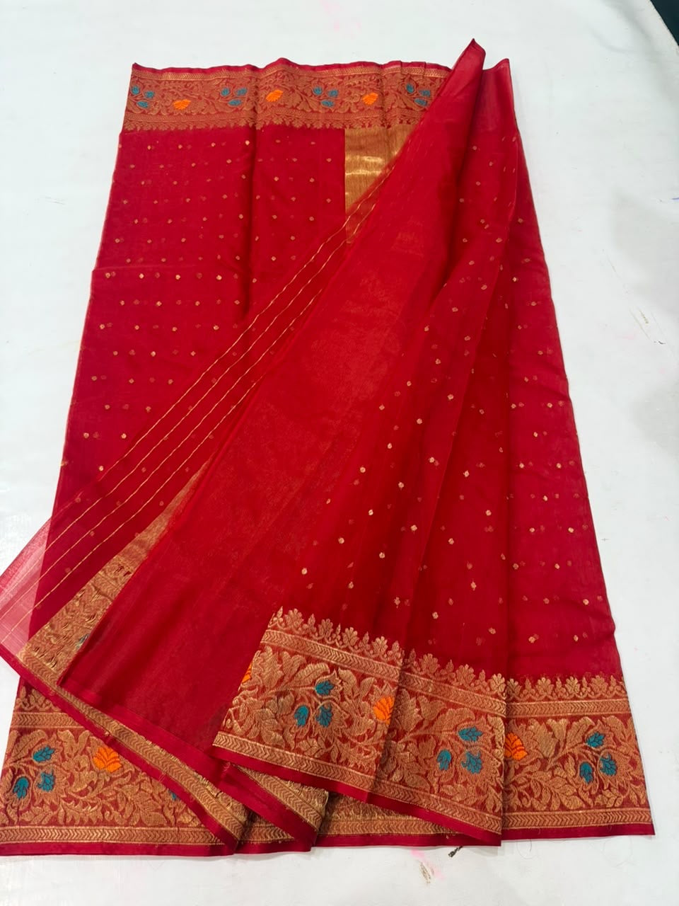 Vermilion red Chanderi saree with antique-gold floral border