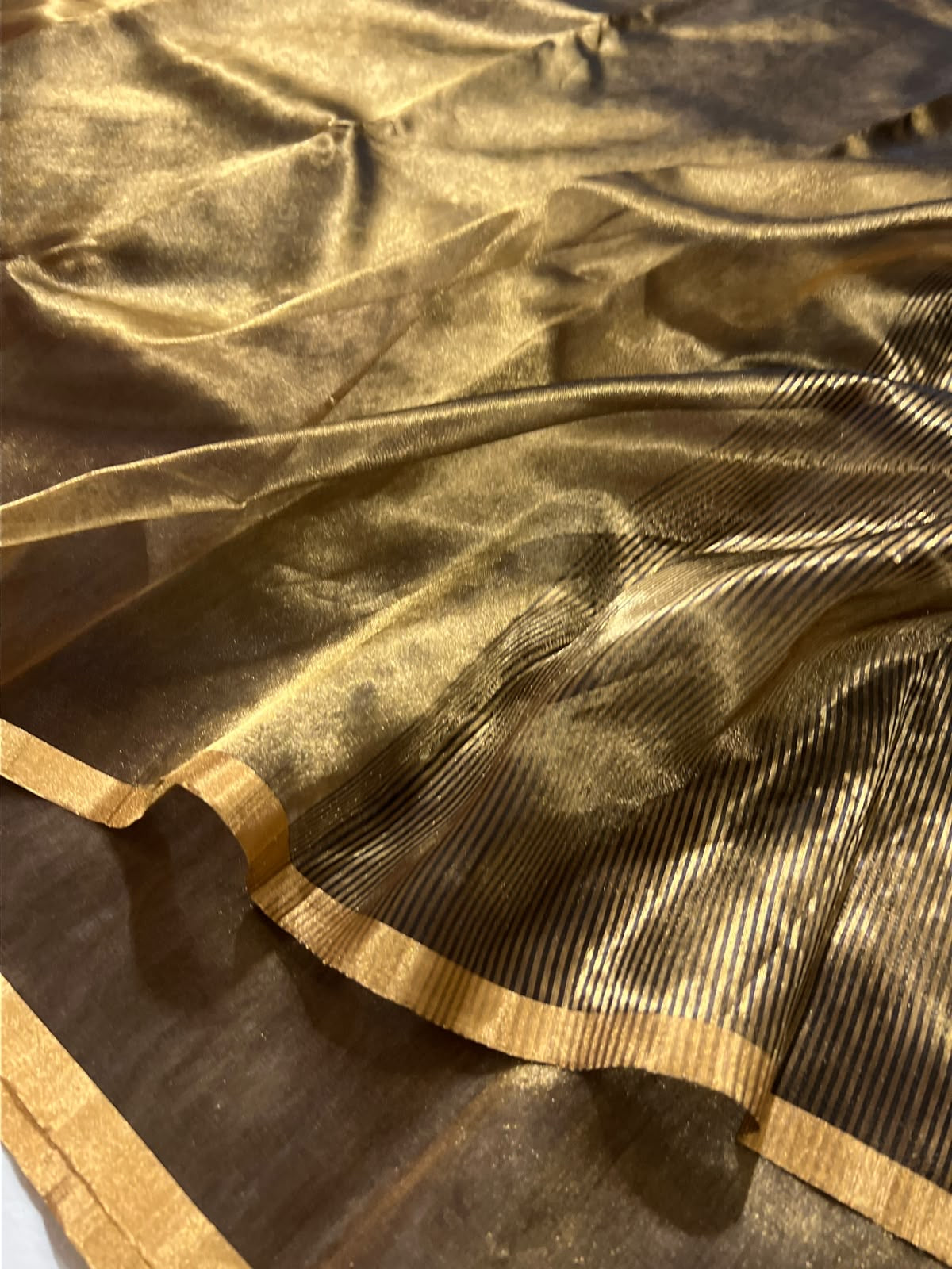 Burnished bronze Chanderi Katan Silk saree, alternate view of the narrow warm-gold border and rich sheen.