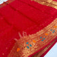 Texture detail of vermilion red Chanderi silk with gold butis