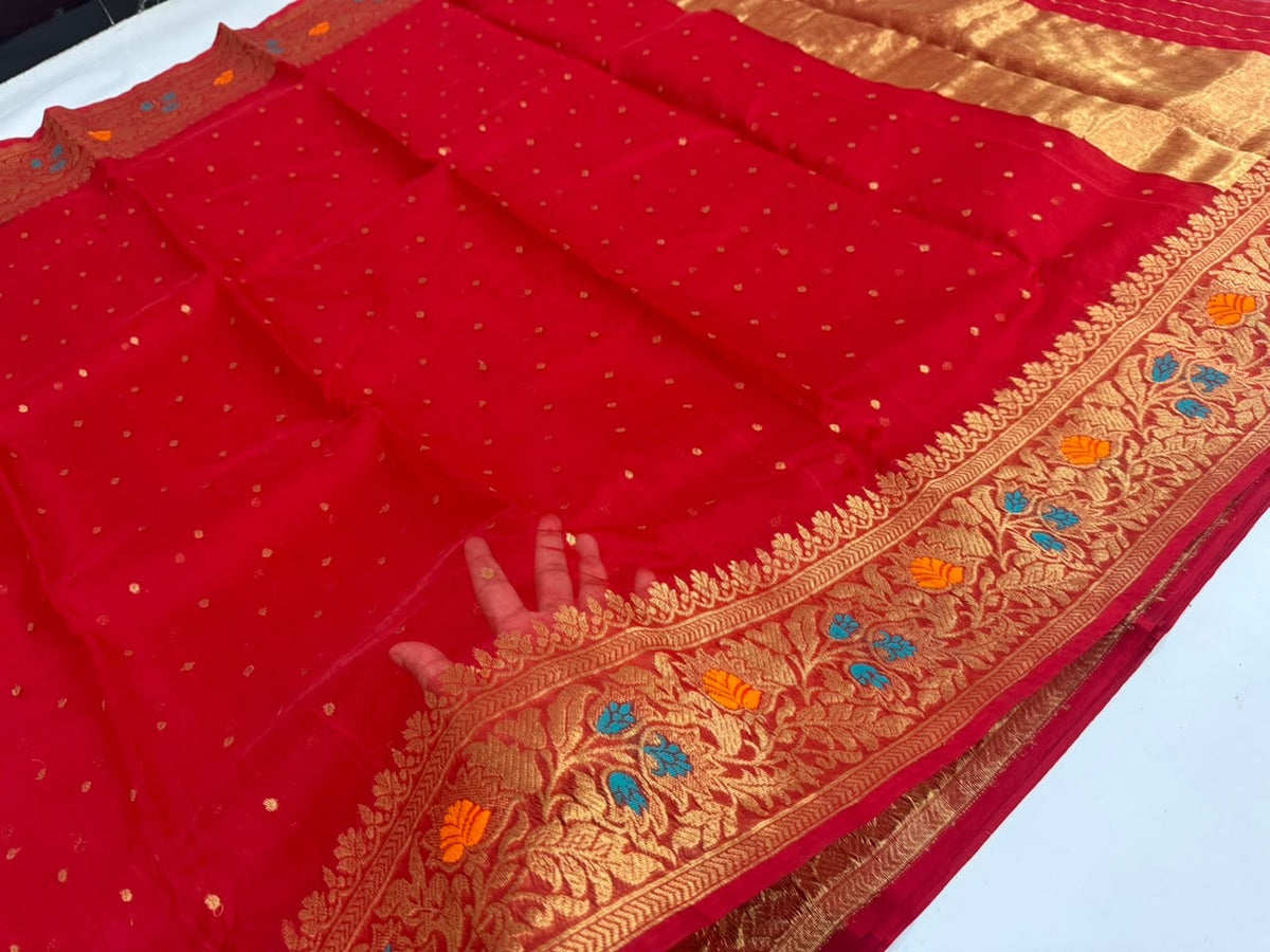 Texture detail of vermilion red Chanderi silk with gold butis