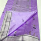 Lilac Pattu silk Chanderi saree laid open showing white floral butis, silver-toned striped border and pallu