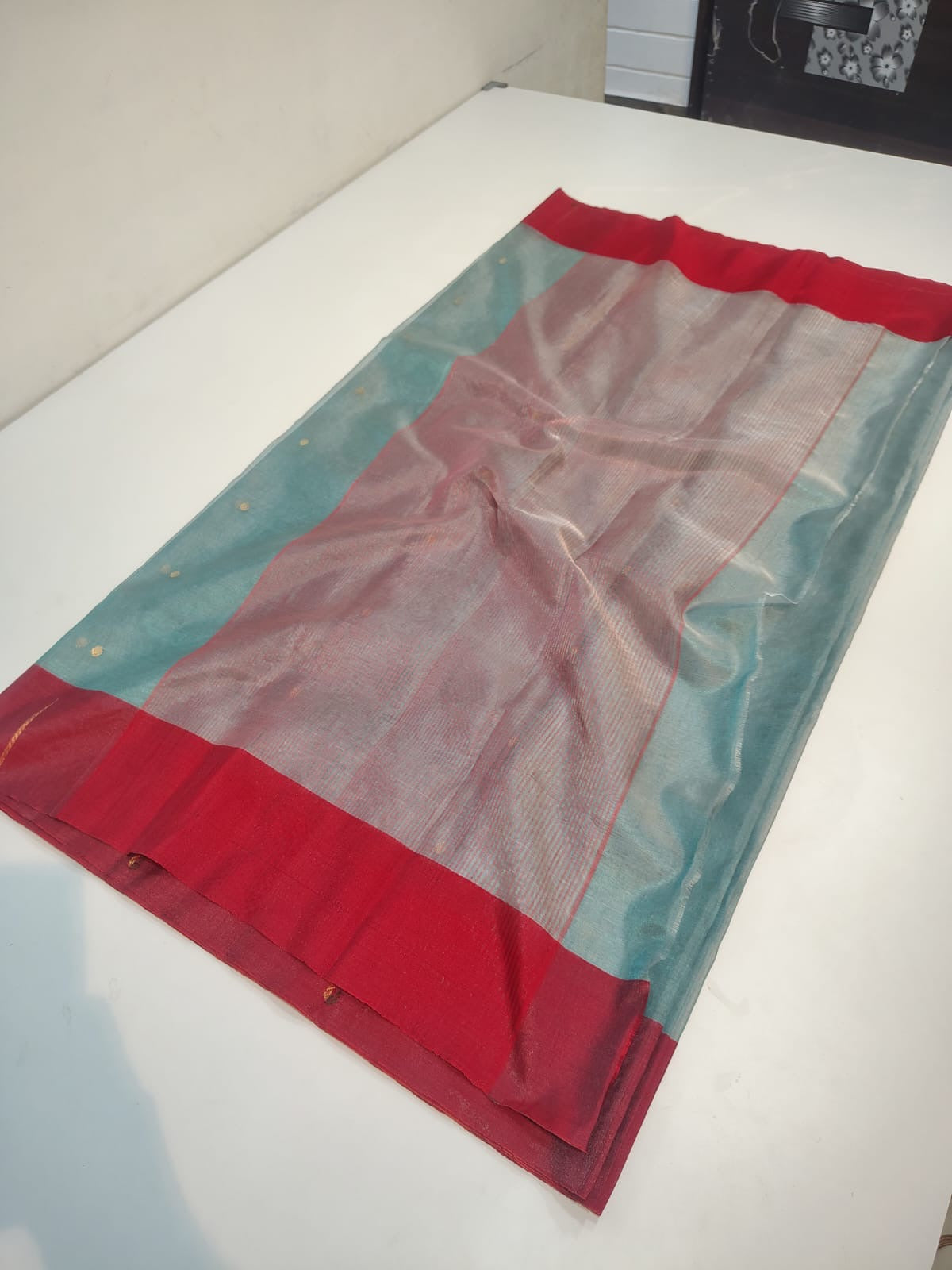 Mist blue Chanderi Tissue Silk saree with crimson borders, tiny gold-toned dots and rose-silver jari pallu