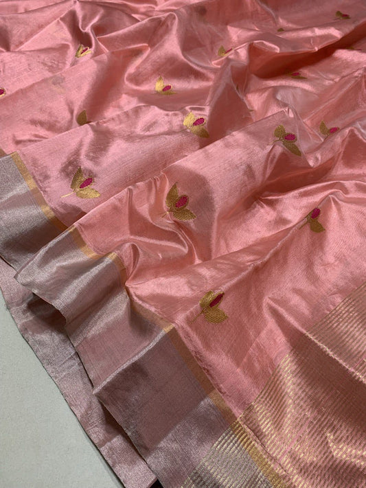 Close up of blush pink Chanderi saree leaf butti detail with traditional zari weave