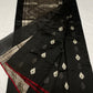 Midnight black Chanderi Pattu Silk saree with silver floral motifs, emerald accents and burgundy-red edges