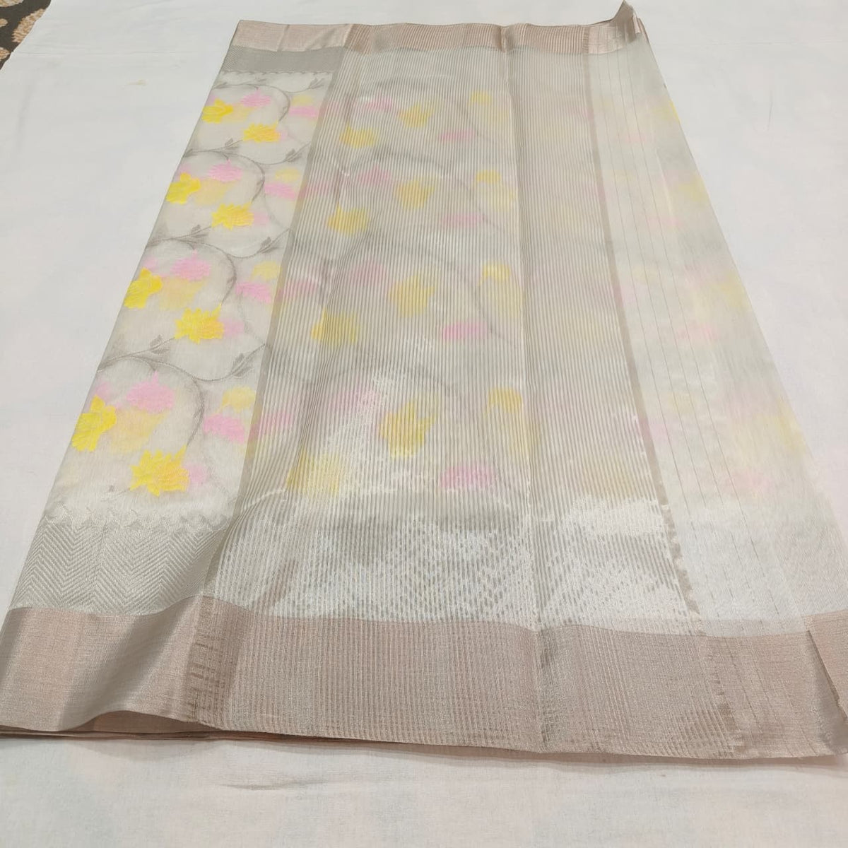 Silver-toned woven border of warm ivory floral Chanderi saree