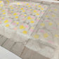 Warm ivory Chanderi saree with pink and yellow floral vines and silver-toned geometric border