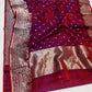 Berry red Chanderi handloom saree with silver-rose pallu draped over the shoulder