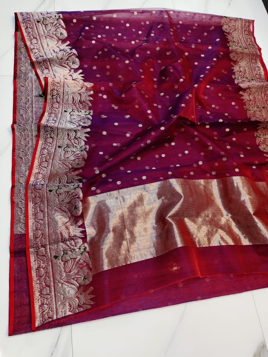 Berry red Chanderi handloom saree with silver-rose pallu draped over the shoulder