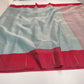 Chanderi Tissue Silk saree showing lagoon-blue body, bright red border and fine metallic pallu lines