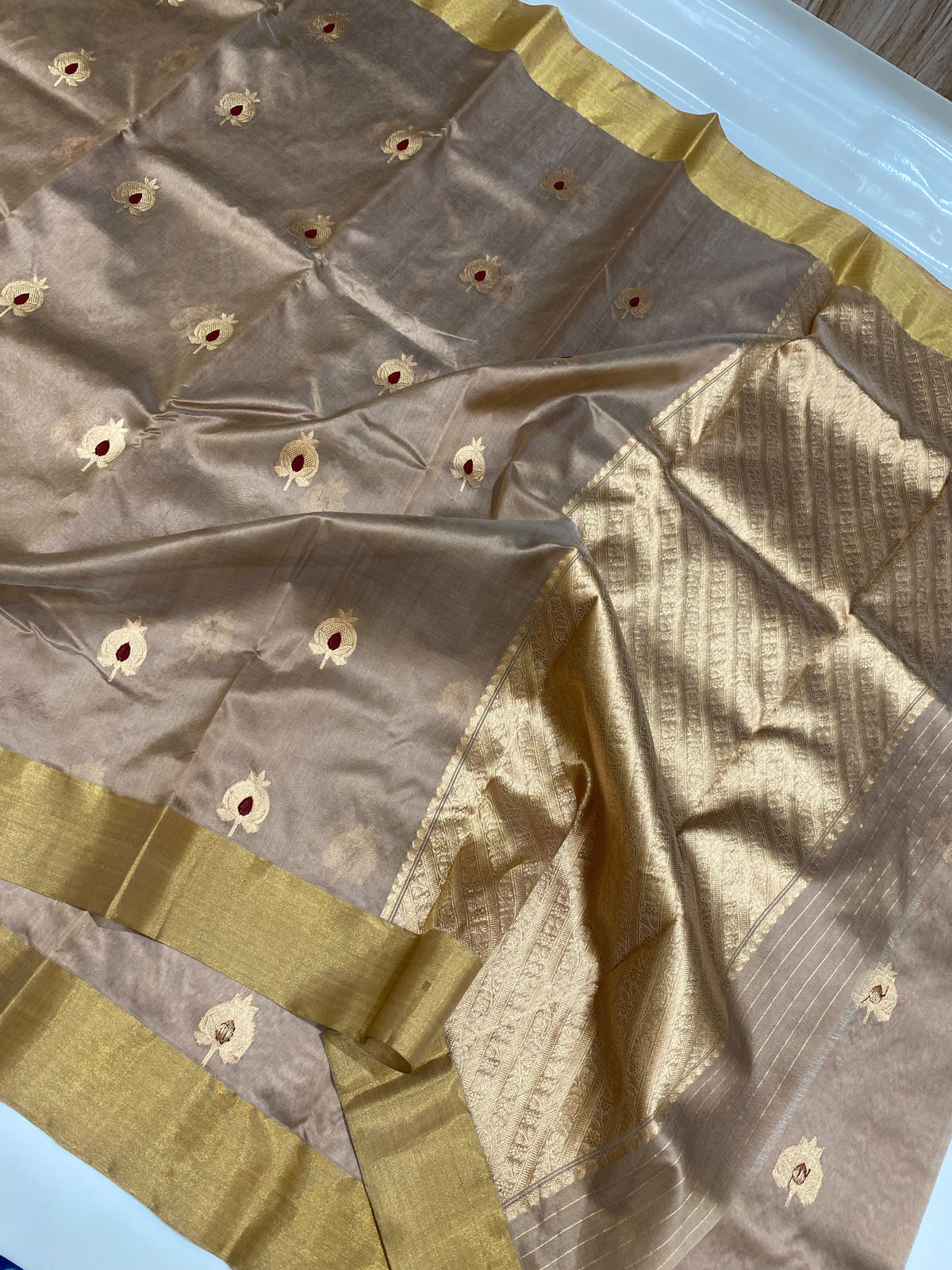 Champagne beige Chanderi handloom saree with maroon-centred buttas