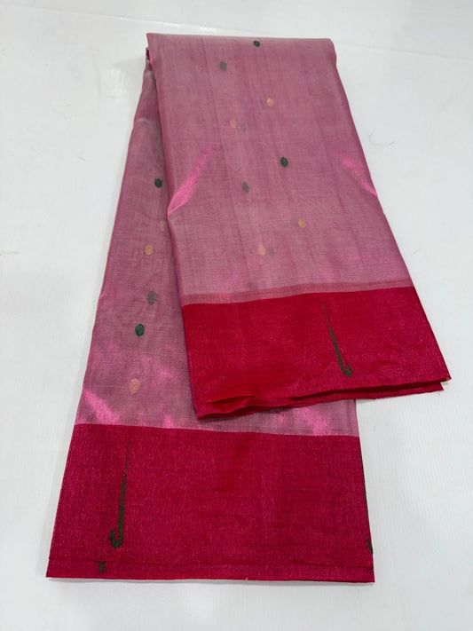 Pure silk Chanderi zari tissue saree laid flat showing translucent body and red border