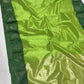 Detail of silver floral buttas on the Parrot Green Pattu Silk Chanderi saree