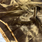 Burnished bronze Chanderi Katan Silk saree with antique-gold sheen, narrow golden borders and fine dark striped pallu.
