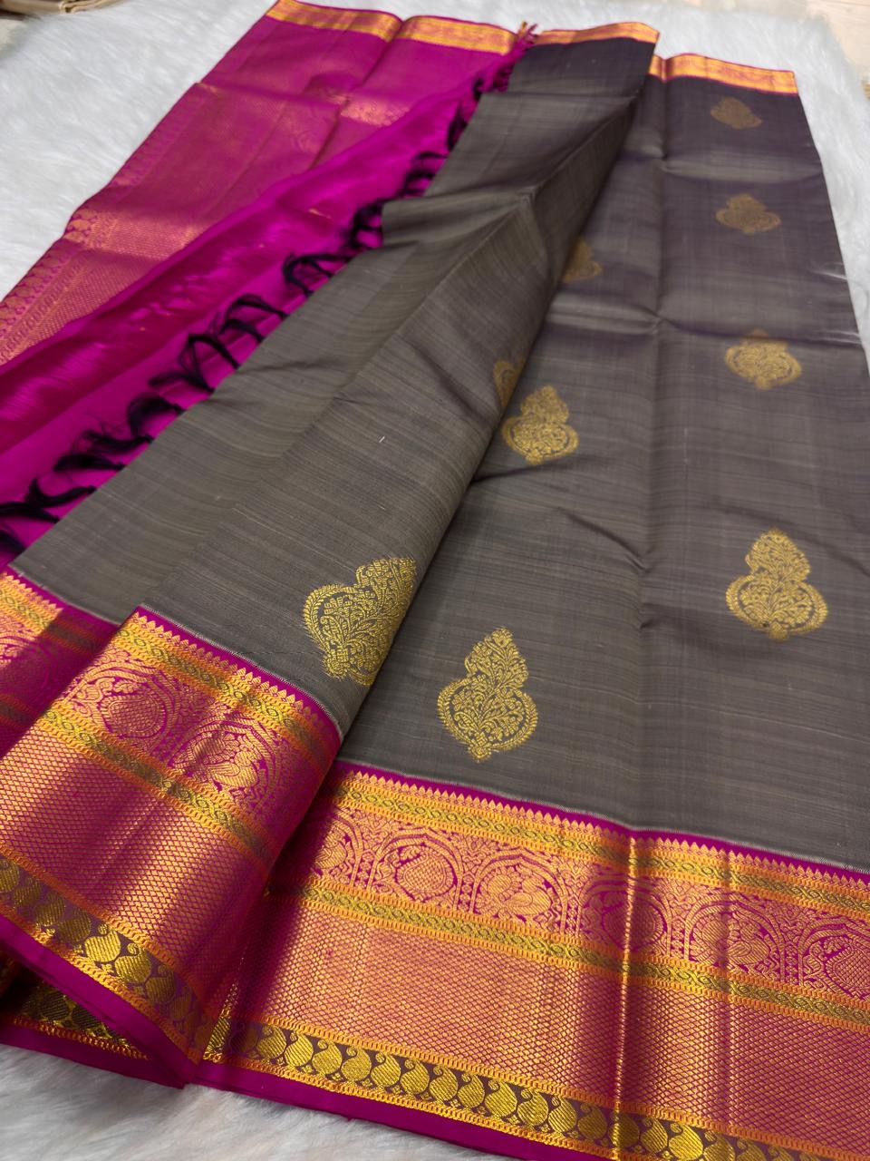 Curated Pure Silk Kanchipuram sarees including the Charcoal Grey and Rani Pink Korvai design.