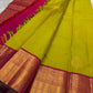 Chartreuse green Kanjeevaram silk saree showing flower butta on body and magenta Korvai border — Idam Living