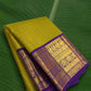 Pure Kanchipuram silk saree in chartreuse green with royal indigo border and Annapakshi zari motifs