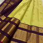 Deep purple pallu of lime chartreuse Kanjipuram pure silk saree with cascading Kai Korvai dense antique gold zari