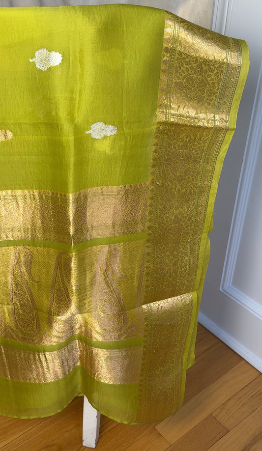 Close view of kadhua gold and silver zari buttas on chartreuse kora silk Banarasi saree body