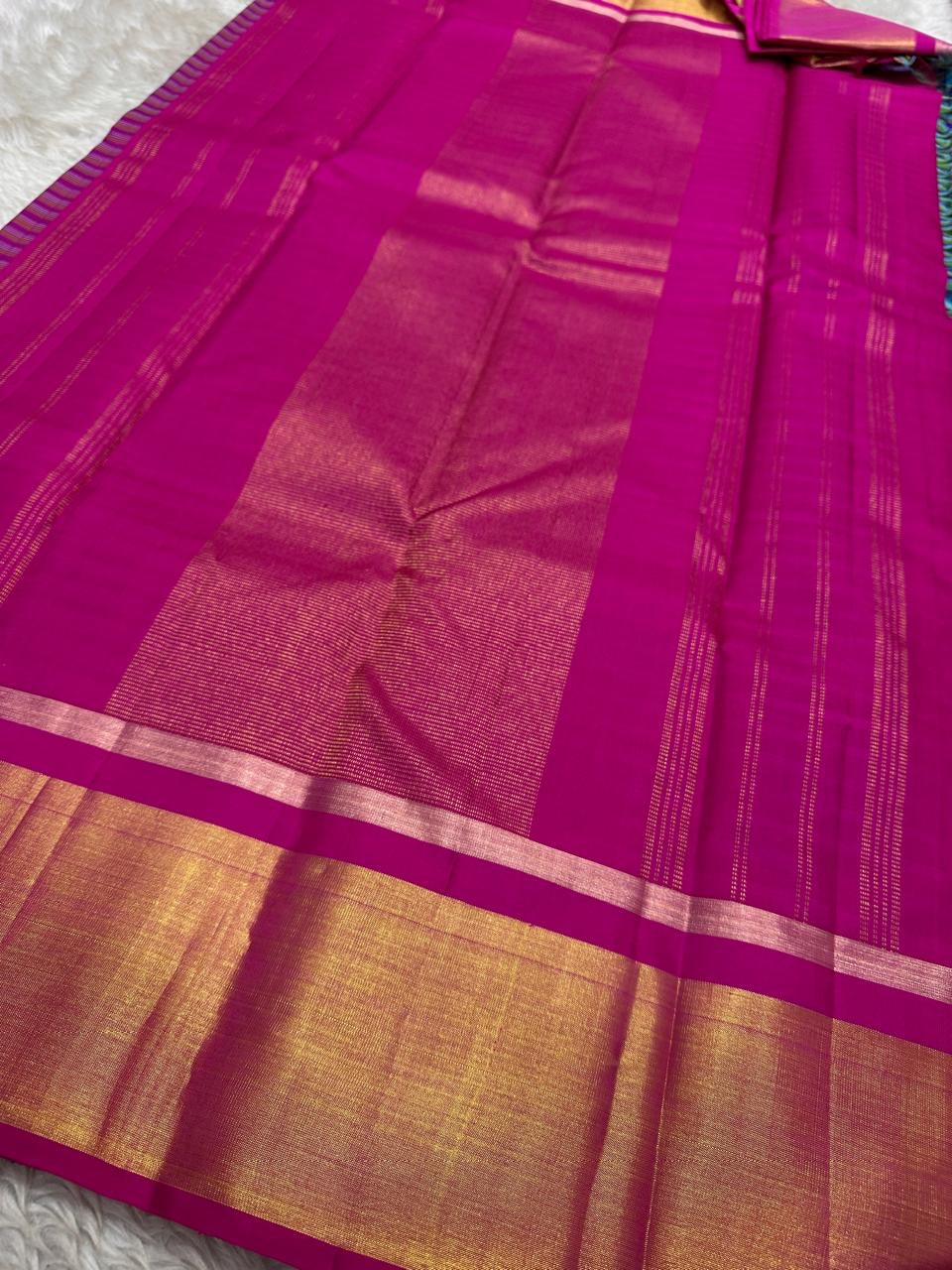 Magenta pallu close-up with gold zari sheen and a thin zari line near the checked body edge (shipped from New Jersey USA)