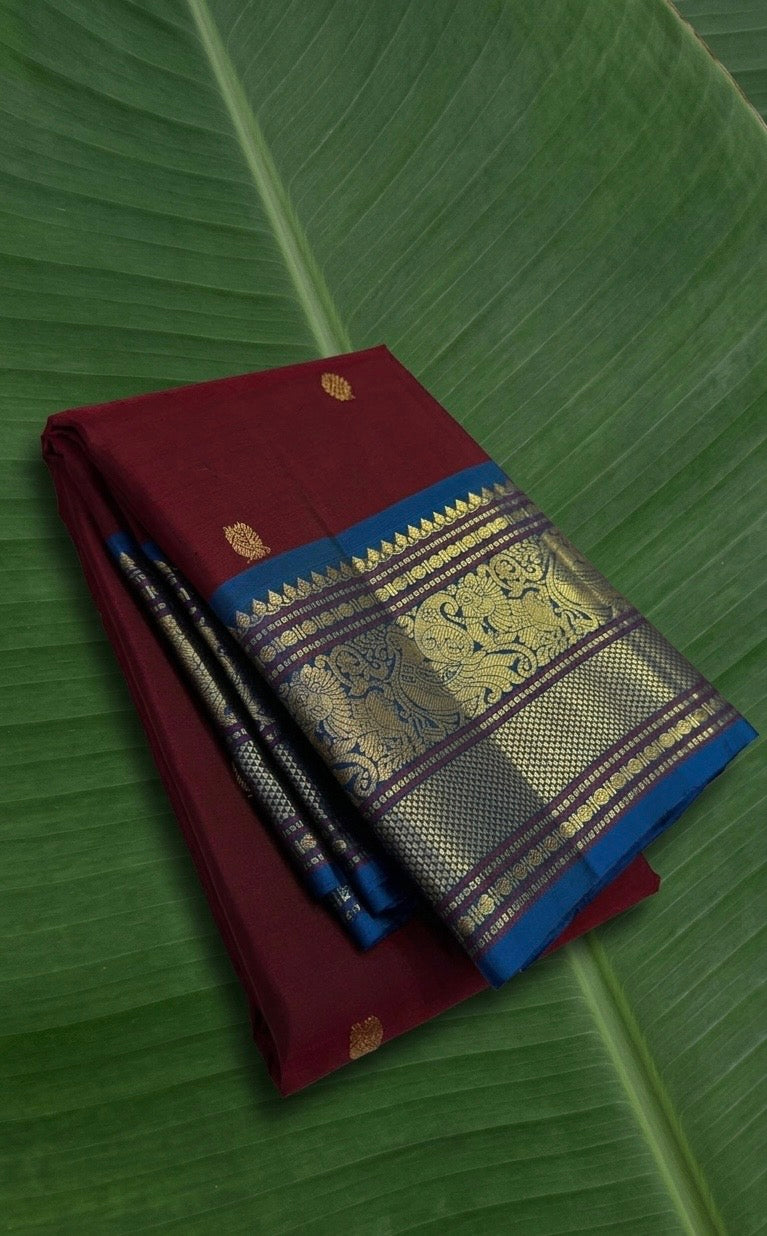 Kanchipuram silk saree in korvai with cherry wine border weave folded view