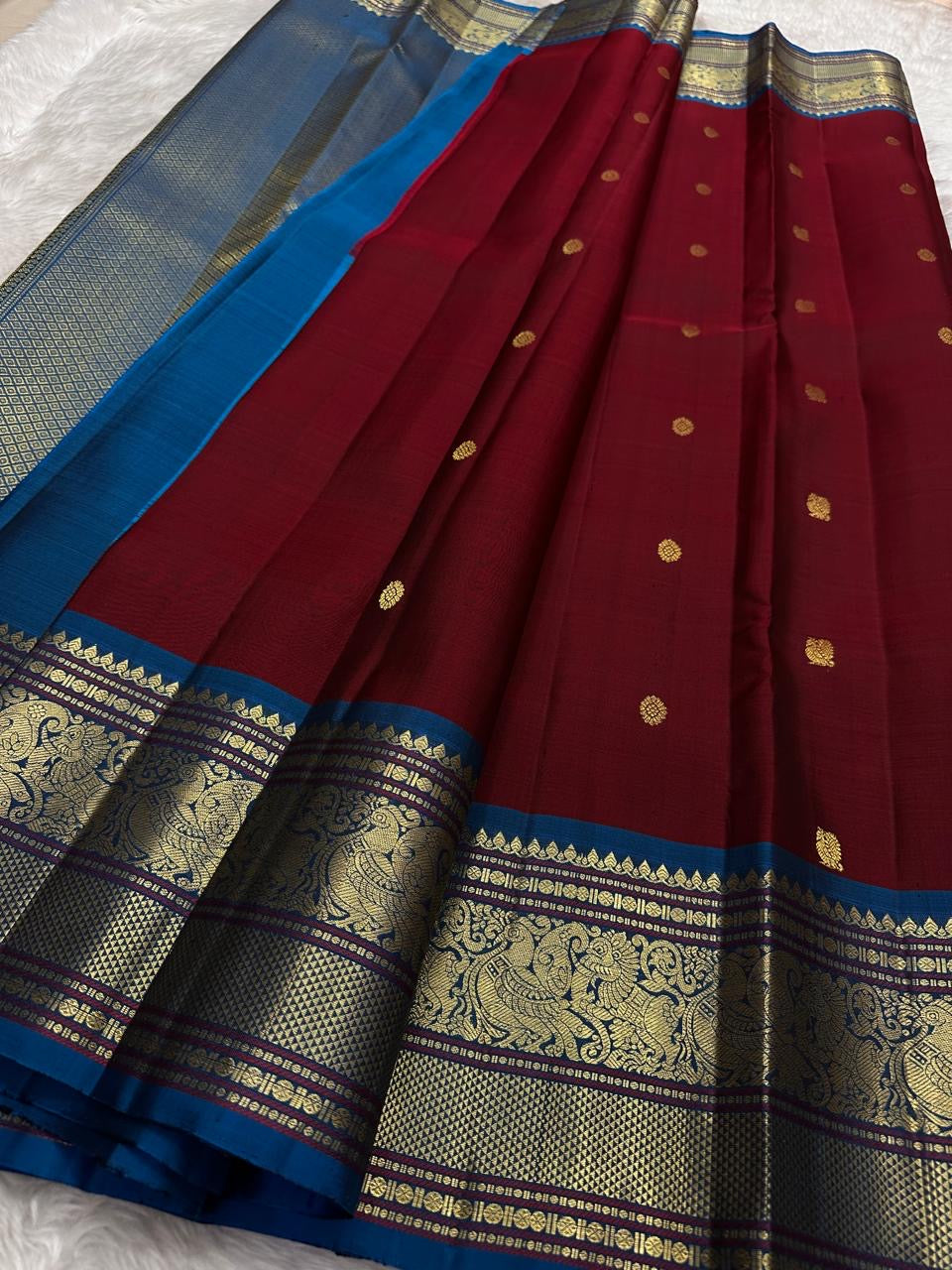 Kanchipattu silk saree in korvai with cherry wine border weave traditional zari detail
