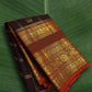 Mayil butta in gold zari close-up on chocolate brown Kancheepuram pure silk saree — Idam Living
