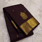 Deep chocolate brown Kanjipuram silk saree body close-up showing Maanga paisley gold zari butta motifs