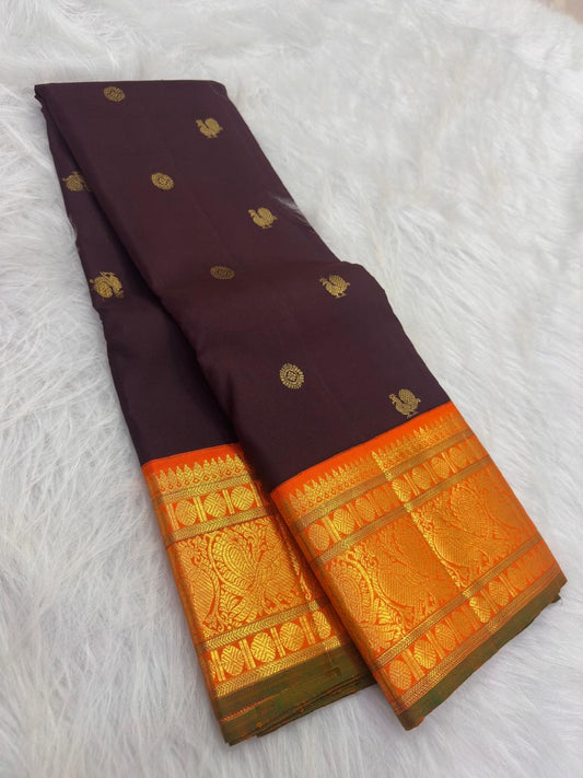 Chocolate brown pure silk body showing the measured spacing of gold Mayil Chakram buttas.