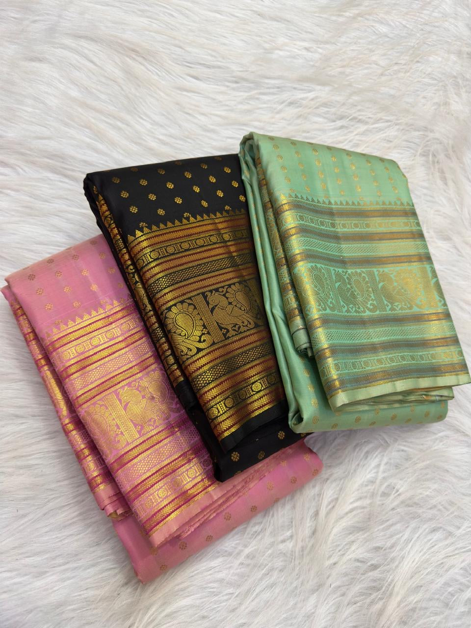 Classic Black handwoven pure silk Kancheepuram Butta saree — gold zari butta close-up on body — Idam Living
