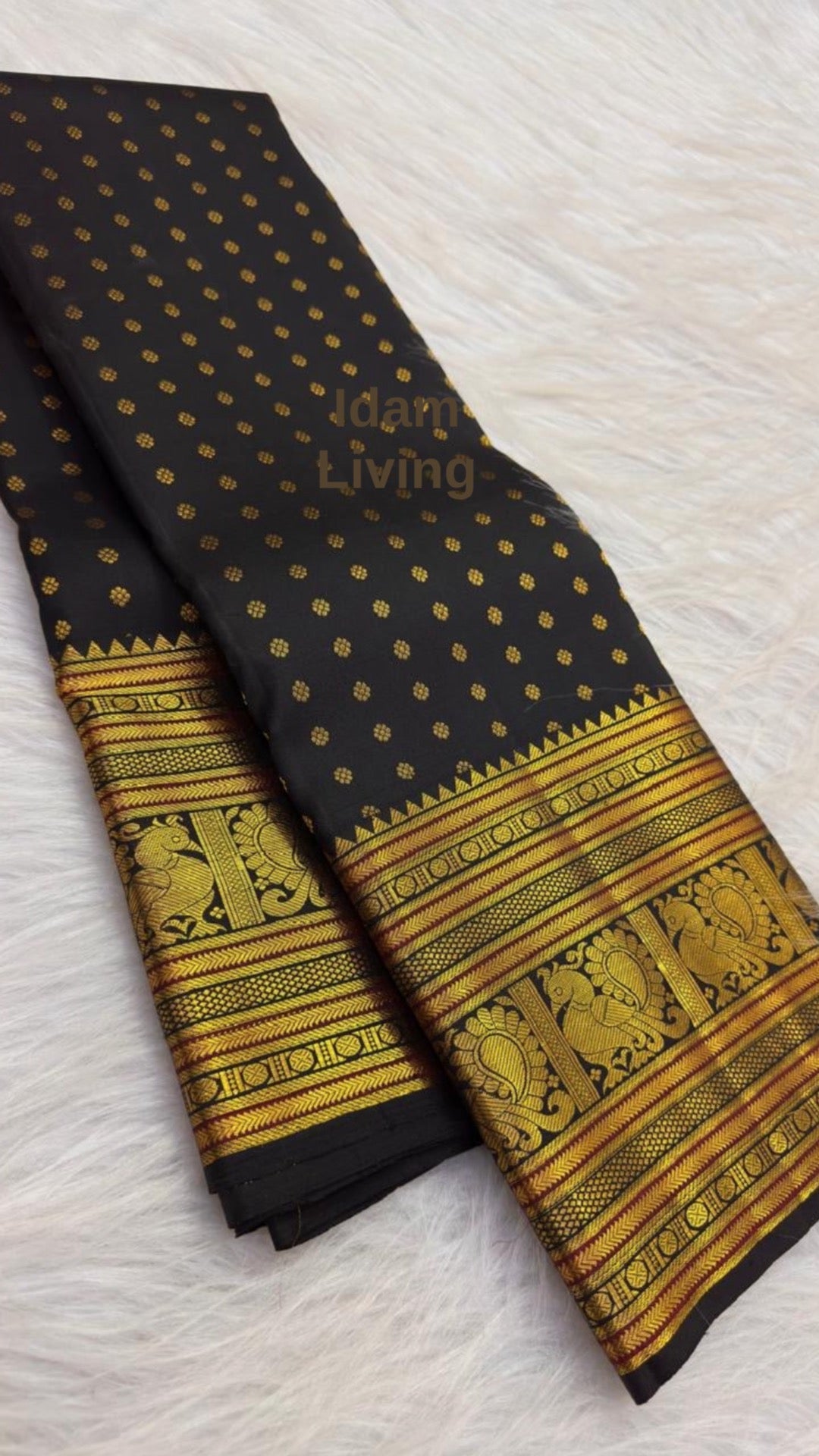 Classic Black KanchiPattu Saree — body close-up showing scattered gold zari buttas