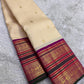 Classic Ivory Kanjipuram Saree — body close-up showing gold zari checks and buttas