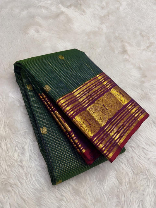 Pure Kanchipuram silk saree in emerald green with traditional gold zari kattam checks by Idam Living