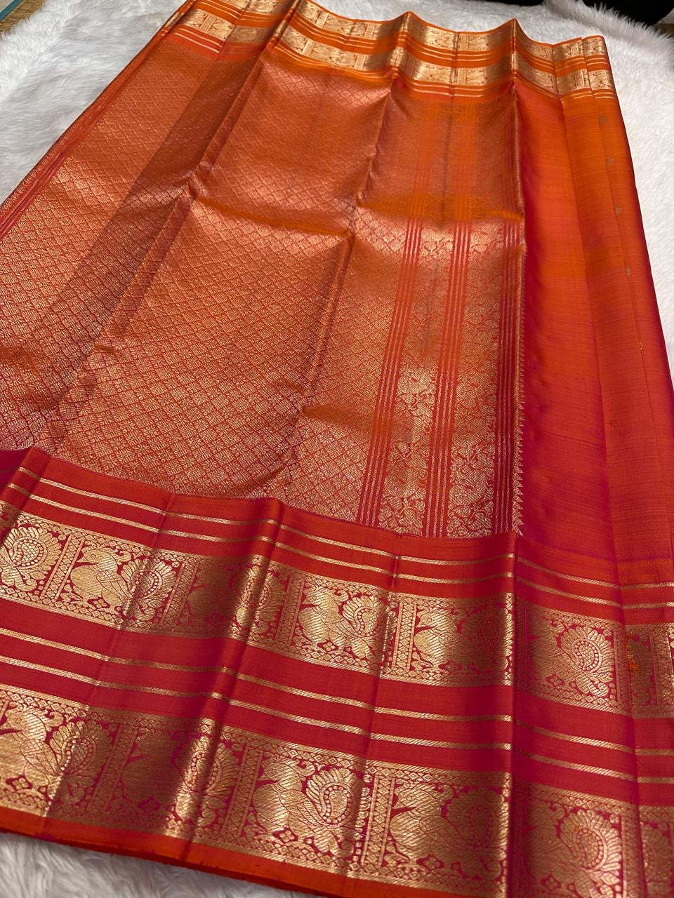 Kanjeevaram silk saree in vermilion red with gold border Mayil Butta weave pallu detail