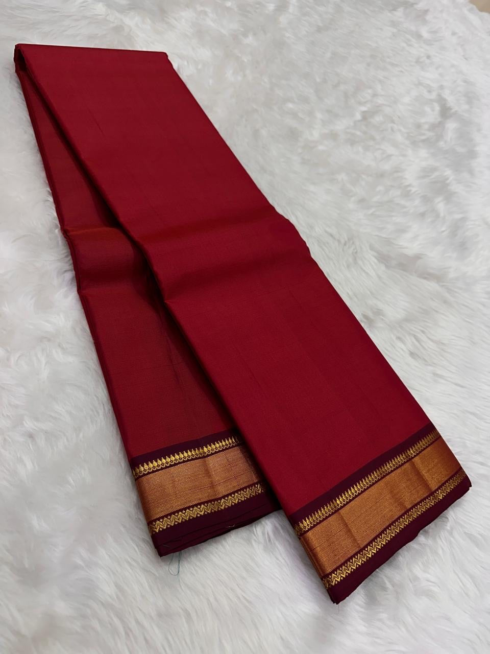 Brick Red and Deep Arakku Maroon lightweight Kanchipuram silk saree, broad gold zari border and striped maroon pallu; border detail