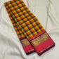 Pure Kanchipuram silk saree folded to show multicolor checks and wide pink and gold zari borde