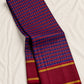 Cobalt blue and maroon handwoven Pure Silk Kancheepuram Kanchi Kattam saree with fine gold grid and red Rettapet border, folded silk detail