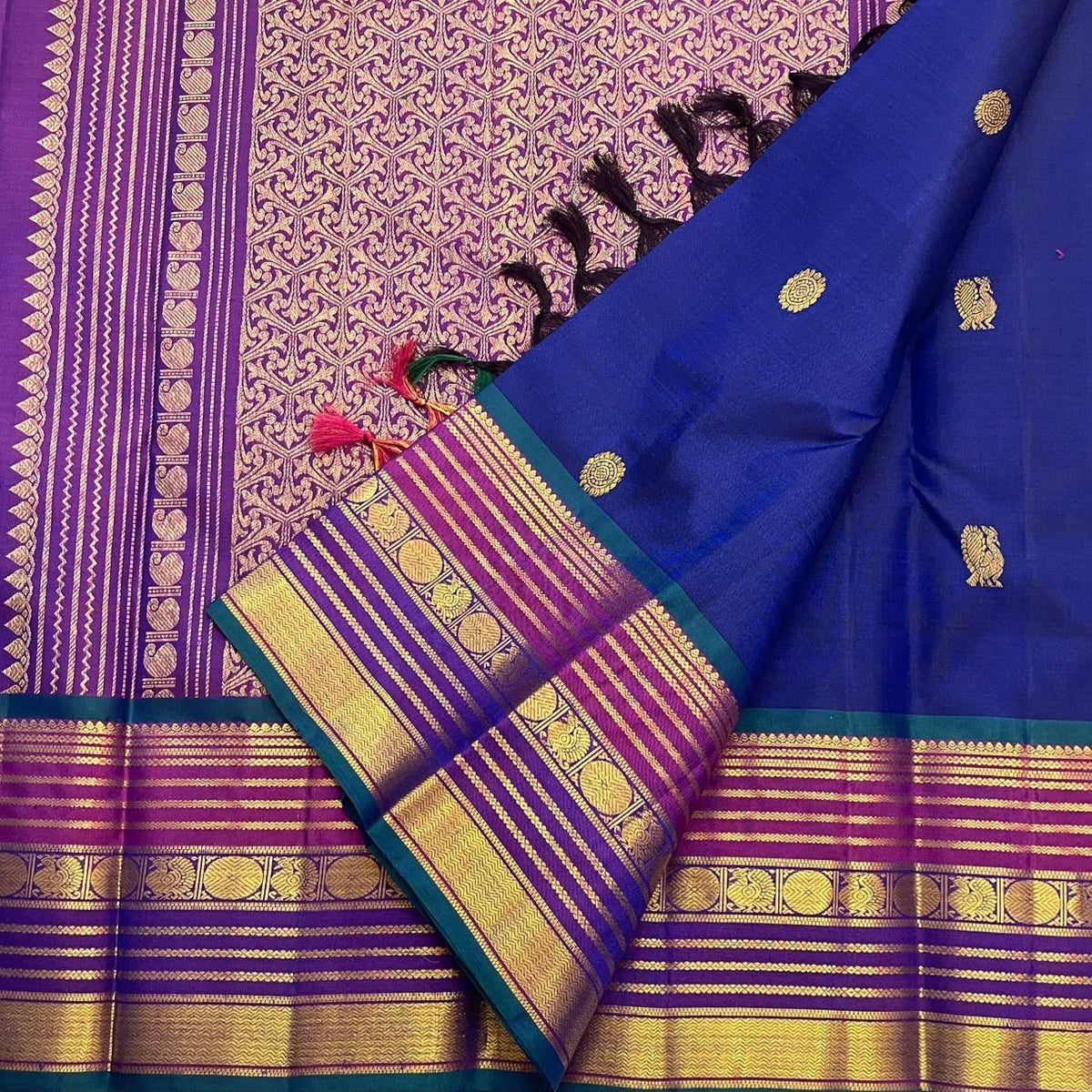 Cobalt blue handwoven Kanchipuram saree with jewel-toned contrast border
