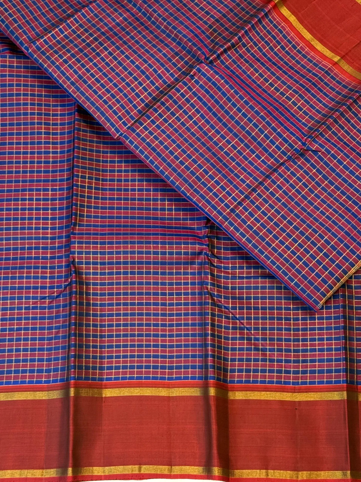 Cobalt blue and maroon handwoven Pure Silk Kancheepuram Kanchi Kattam saree with fine gold grid and red Rettapet border, body weave detail