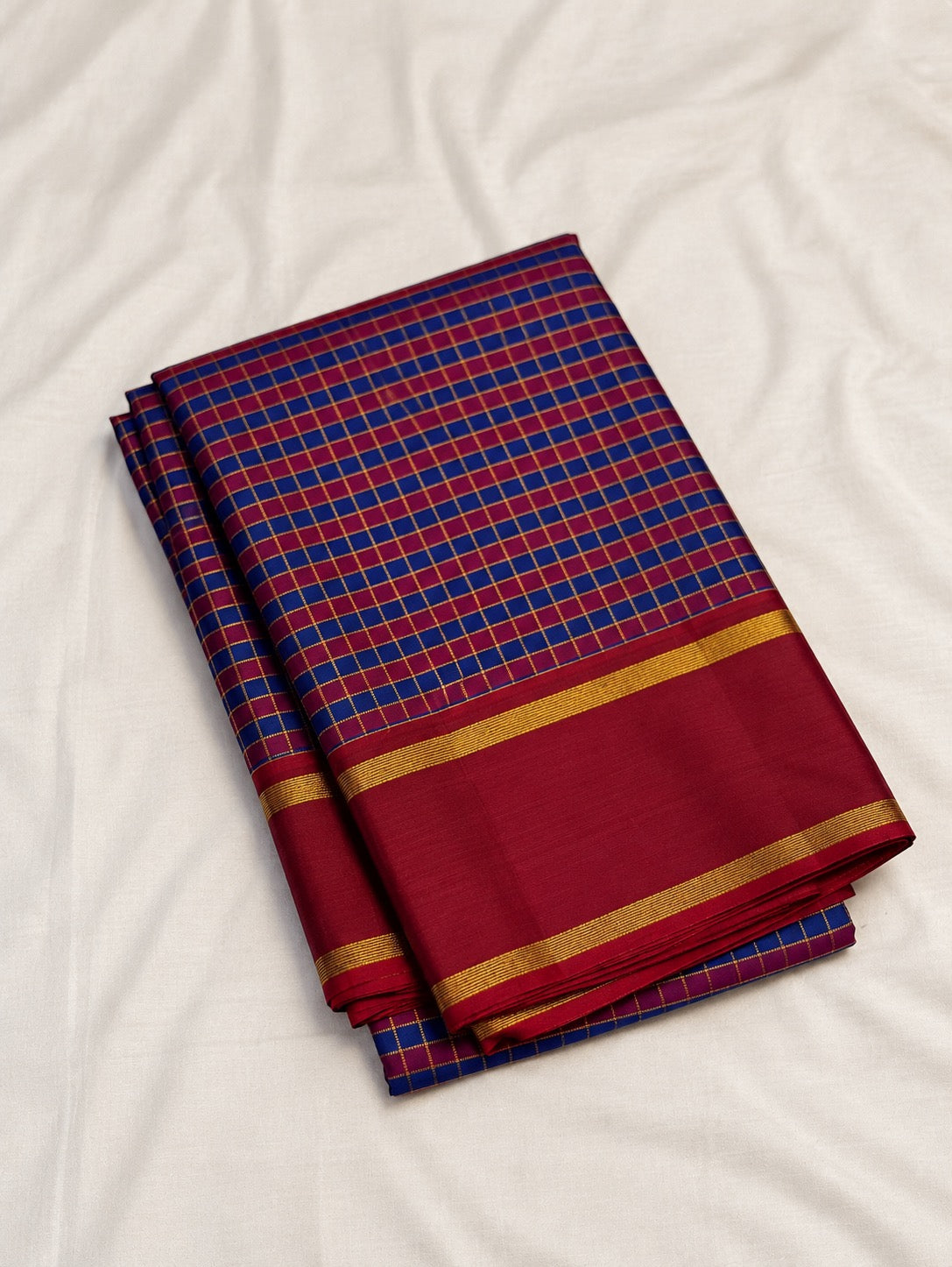 Cobalt blue and maroon handwoven Pure Silk Kancheepuram Kanchi Kattam saree with fine gold grid and red Rettapet border, border detail