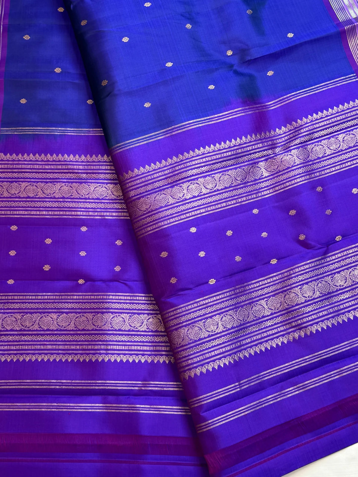 Cobalt blue Pure Silk Kanchipuram Butta saree with violet zari border