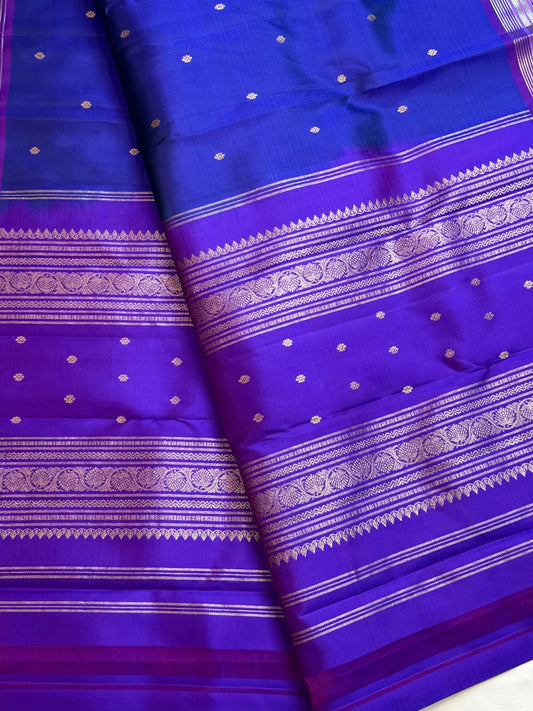 Cobalt blue Pure Silk Kanchipuram Butta saree with violet zari border