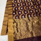 Deep Cocoa Brown Pattu Silk Chanderi saree detail with luminous antique-gold weaving.