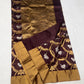 Draped Cocoa Brown handloom Chanderi showing gold curving floral vines, silver bird motifs and luminous antique-gold pallu.