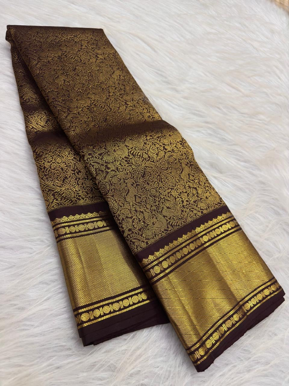 Deep cinnamon brown pure silk Kanchipuram saree with all-over floral jaal Vanasringaram motifs, full saree draped view
