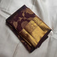 Coffee brown handwoven Kanjivaram Zari Kattam saree showing floral jaal detail.