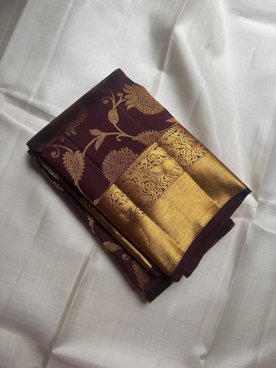 Coffee brown handwoven Kanjivaram Zari Kattam saree showing floral jaal detail.
